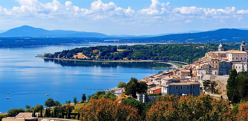 Lake Bracciano with castle and hilltop town in summer sun