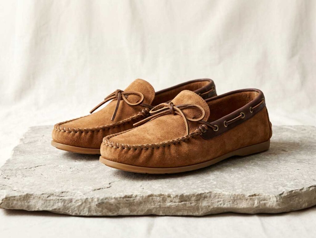 Soft moccasins with visible toe stitching and a relaxed silhouette