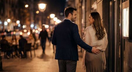 What Does It Mean When a Guy Touches Your Lower Back? Man gently touching a woman’s lower back as they walk into a restaurant